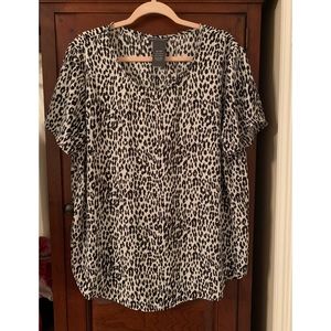 Floral 100% polyester short sleeve blouse. Longer in the back